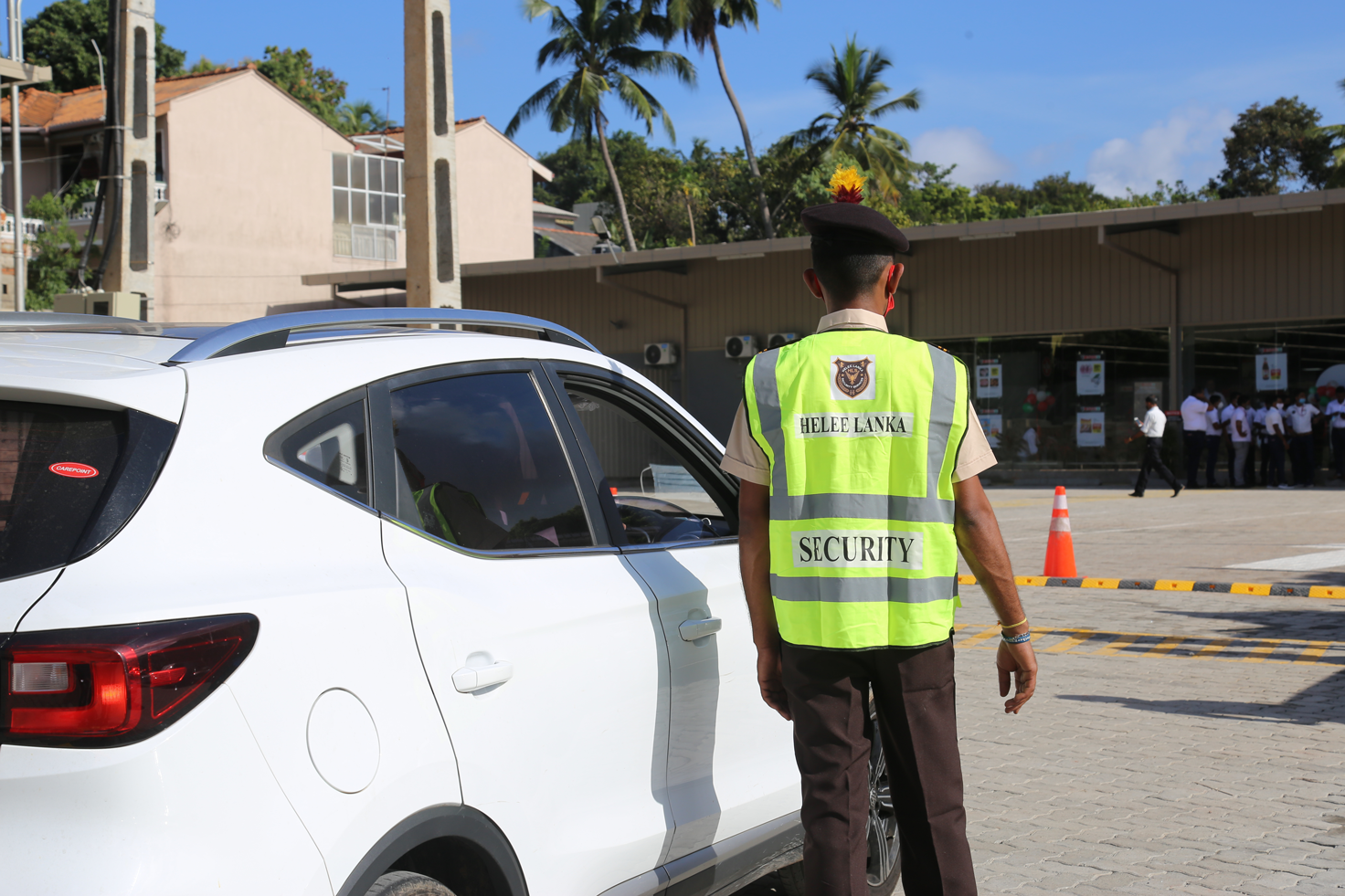 security guard directing traffic one