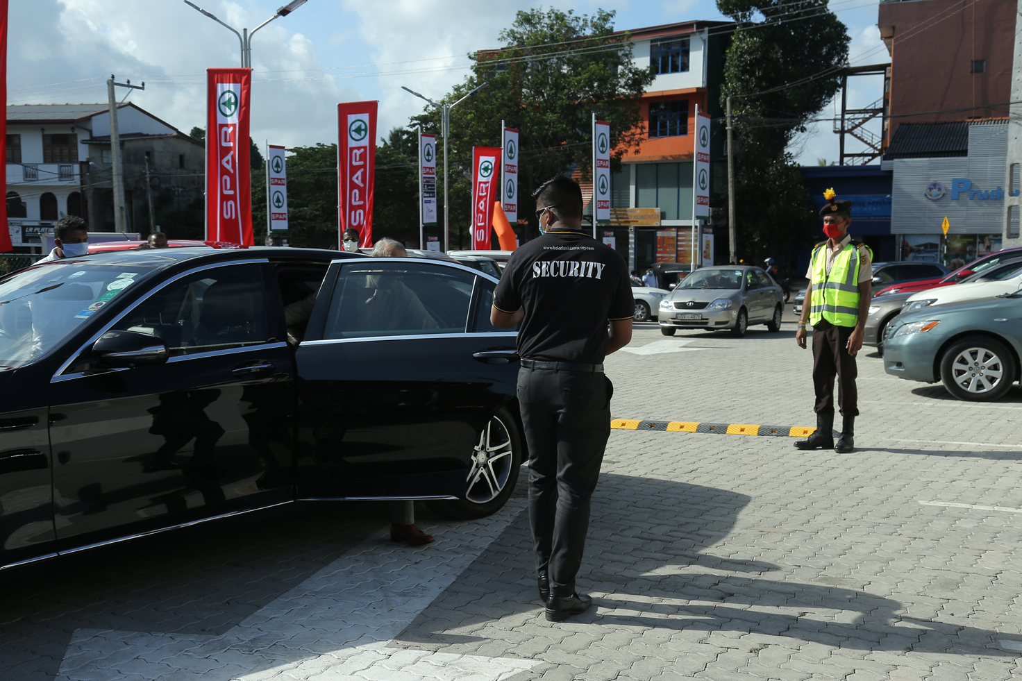 security guard directing traffic two