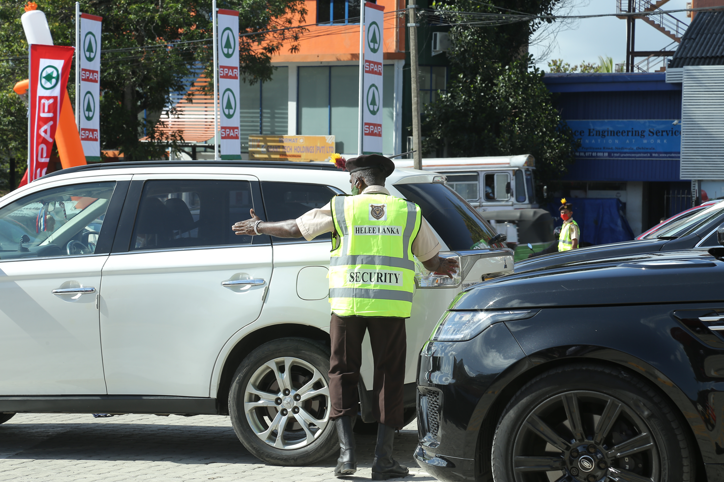 security guard directing traffic three